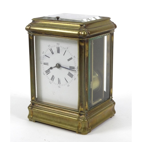 1302 - Brass repeating carriage clock with enamel dial, striking on a gong, 14cm high