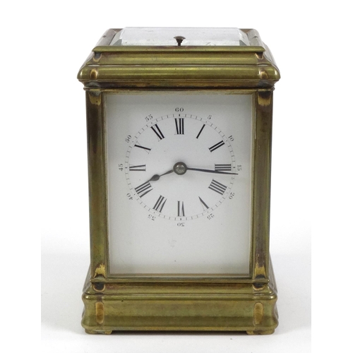 1302 - Brass repeating carriage clock with enamel dial, striking on a gong, 14cm high