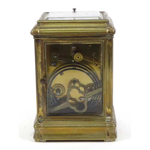 1302 - Brass repeating carriage clock with enamel dial, striking on a gong, 14cm high