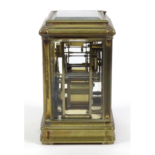 1302 - Brass repeating carriage clock with enamel dial, striking on a gong, 14cm high