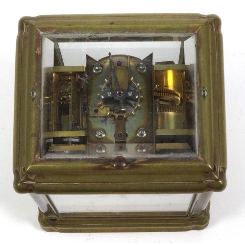 1302 - Brass repeating carriage clock with enamel dial, striking on a gong, 14cm high