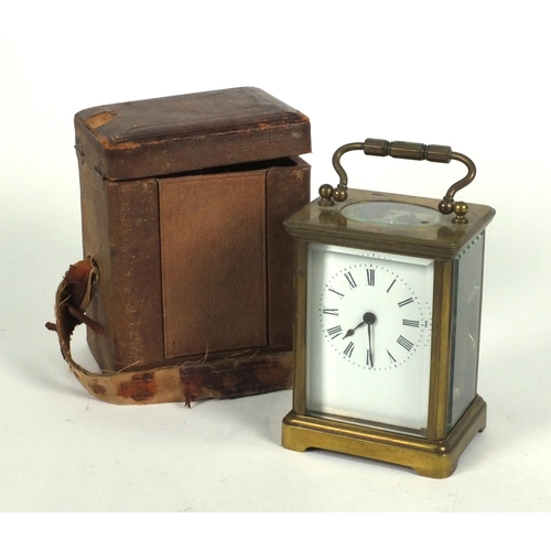 1305 - Brass carriage clock in a leather carrying case, 10cm high