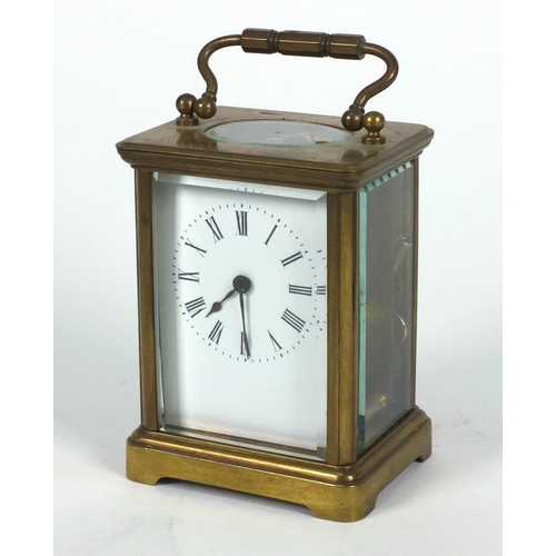 1305 - Brass carriage clock in a leather carrying case, 10cm high