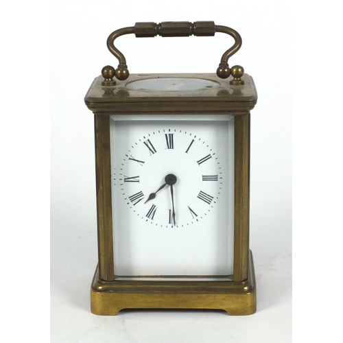 1305 - Brass carriage clock in a leather carrying case, 10cm high