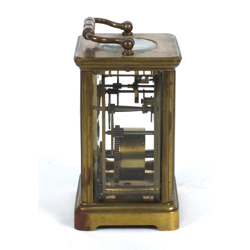 1305 - Brass carriage clock in a leather carrying case, 10cm high