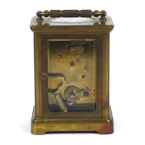 1305 - Brass carriage clock in a leather carrying case, 10cm high