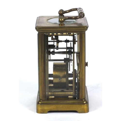 1305 - Brass carriage clock in a leather carrying case, 10cm high