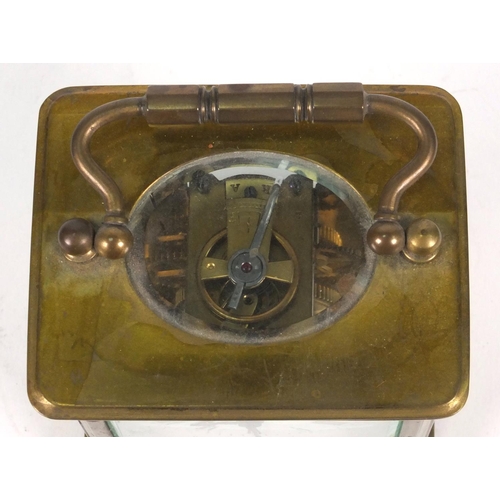 1305 - Brass carriage clock in a leather carrying case, 10cm high