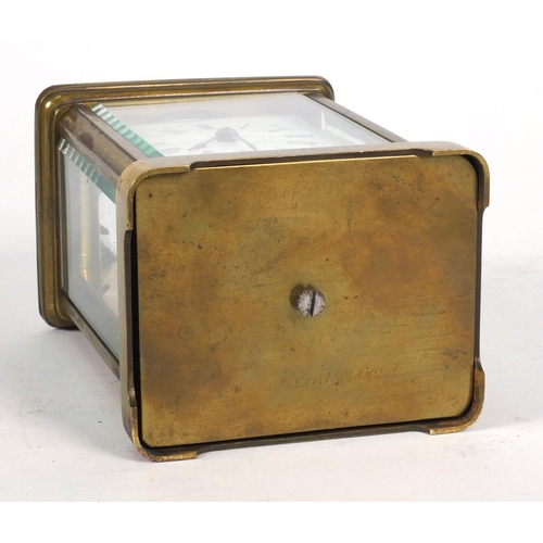 1305 - Brass carriage clock in a leather carrying case, 10cm high