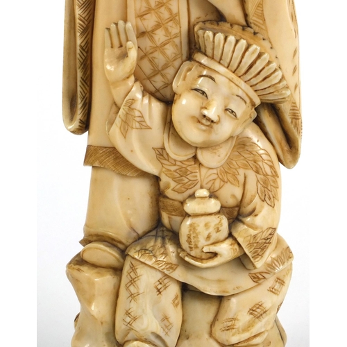 608 - Oriental Chinese ivory carving of an elder and young boy, seal mark to base, 35cm high