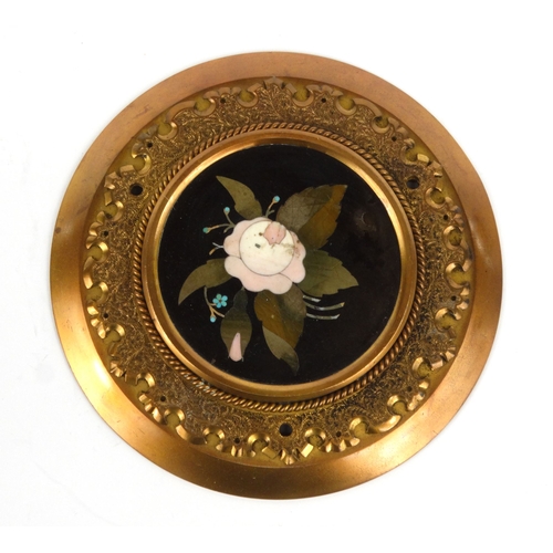 43 - Victorian pietra dura floral marble plaque mounted in a brass surround, 15cm diameter