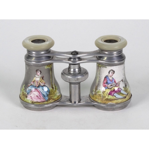 201 - Pair of opera glasses hand painted with lovers, housed in a red velvet case, 10cm long