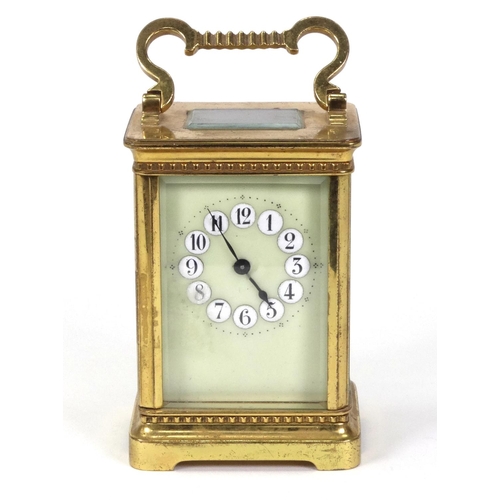 1303 - Brass carriage clock with enamel dial, 11cm high excluding the handle