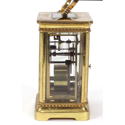 1303 - Brass carriage clock with enamel dial, 11cm high excluding the handle