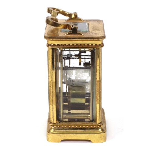 1303 - Brass carriage clock with enamel dial, 11cm high excluding the handle