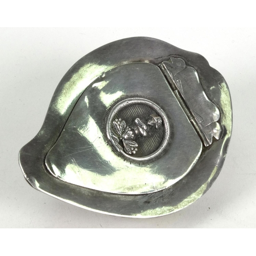 109 - Victorian silver mounted cowrie shell snuff box inset with a panel of a soldier, 8.5cm diameter