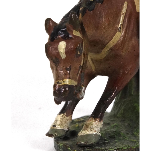 596 - Cold painted bronze model of a huntsman on horseback jumping over a fence, 5cm high