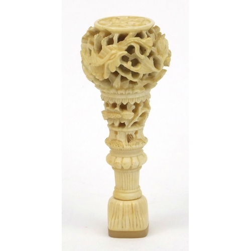 619 - Oriental Chinese ivory and mother of pearl seal with carved floral decoration, 7cm long