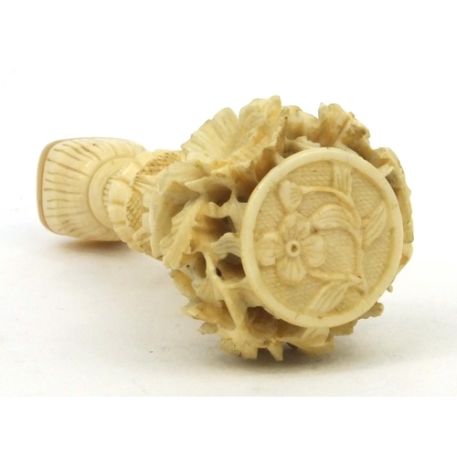 619 - Oriental Chinese ivory and mother of pearl seal with carved floral decoration, 7cm long