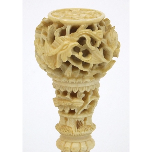 619 - Oriental Chinese ivory and mother of pearl seal with carved floral decoration, 7cm long