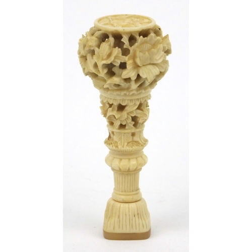 619 - Oriental Chinese ivory and mother of pearl seal with carved floral decoration, 7cm long