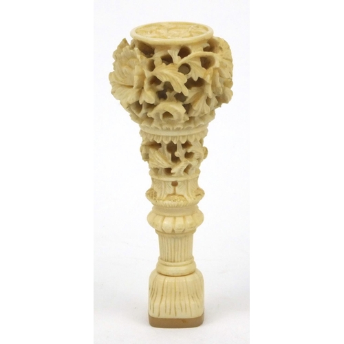 619 - Oriental Chinese ivory and mother of pearl seal with carved floral decoration, 7cm long