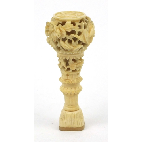 619 - Oriental Chinese ivory and mother of pearl seal with carved floral decoration, 7cm long