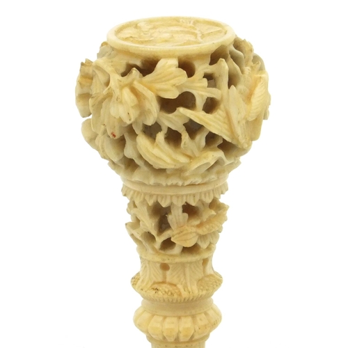 619 - Oriental Chinese ivory and mother of pearl seal with carved floral decoration, 7cm long