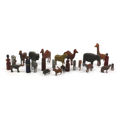 597 - Selection of wooden hand painted Noah's Ark animals and figures including elephants, giraffes and ze... 