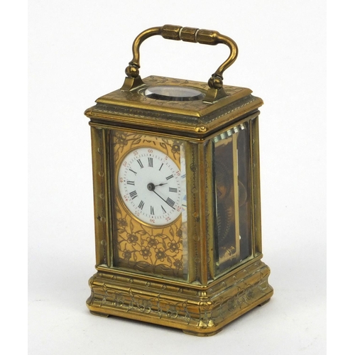 1306 - Miniature brass carriage clock, with floral and enamel dial, the movement stamped 01885, 7cm high ex... 