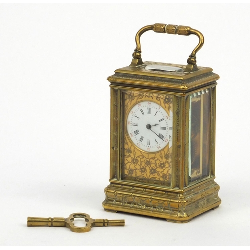 1306 - Miniature brass carriage clock, with floral and enamel dial, the movement stamped 01885, 7cm high ex... 