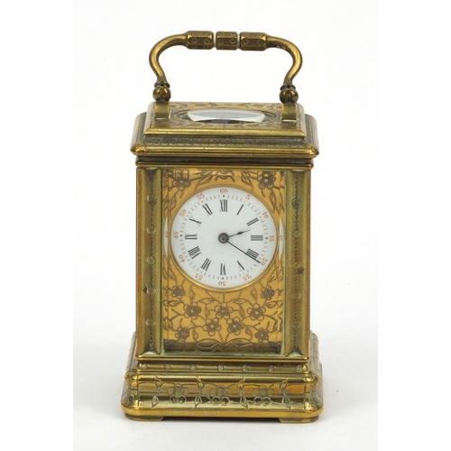 1306 - Miniature brass carriage clock, with floral and enamel dial, the movement stamped 01885, 7cm high ex... 