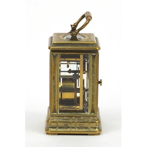 1306 - Miniature brass carriage clock, with floral and enamel dial, the movement stamped 01885, 7cm high ex... 