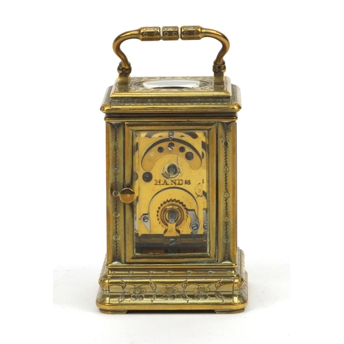 1306 - Miniature brass carriage clock, with floral and enamel dial, the movement stamped 01885, 7cm high ex... 