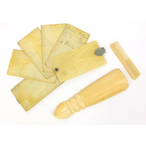 29 - Ivory aide de memoire, ivory shoe horn and a child's comb, the largest 12cm long
