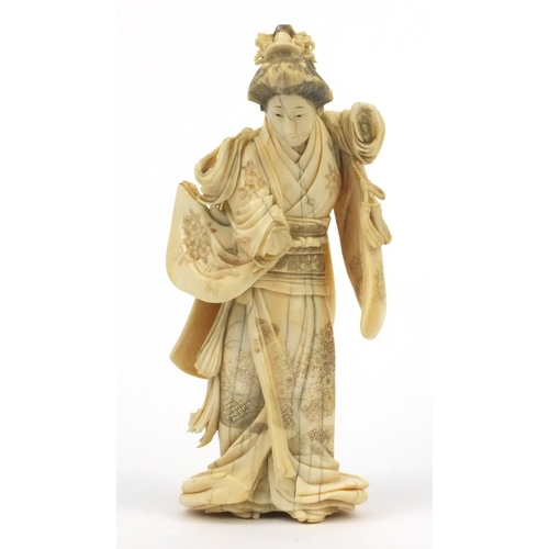 607 - Oriental Japanese ivory carving of a lady with floral gown, signature mark to base, 19cm high
