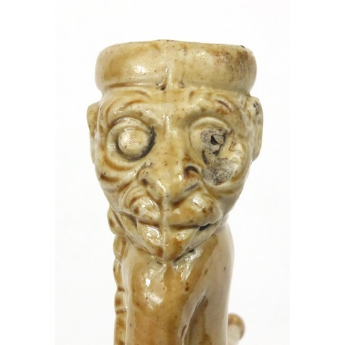 113 - Antique salt glazed stoneware pipe modelled as a monkey, 12cm diameter