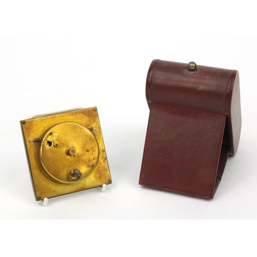 1311 - Cased Jaz folding travelling alarm clock, together with a boxed travelling alarm clock, the larger 1... 