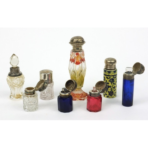 215 - Selection of silver topped cut glass scent bottles including Bristol Blue examples and a floral stai... 