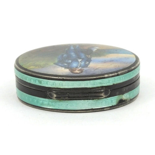 198 - Circular silver pill box enamelled with a figure of a cavalier with feather hat, stamped '925' to th... 