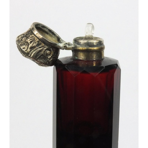 214 - Victorian ruby unmarked silver topped double ended glass scent bottle, 10cm diameter