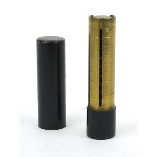 120 - Leather cased brass sovereign holder, 11cm high