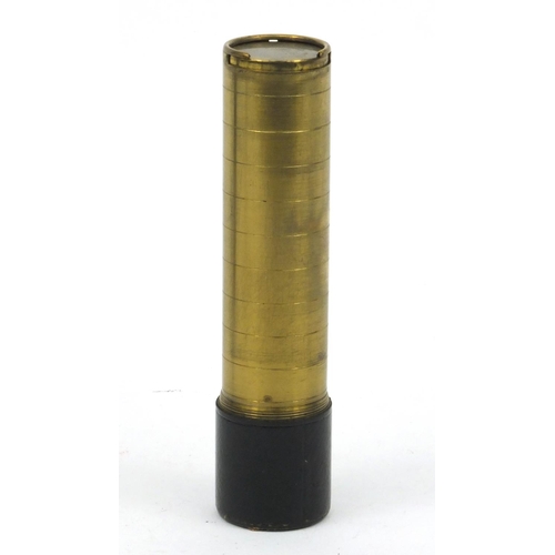 120 - Leather cased brass sovereign holder, 11cm high