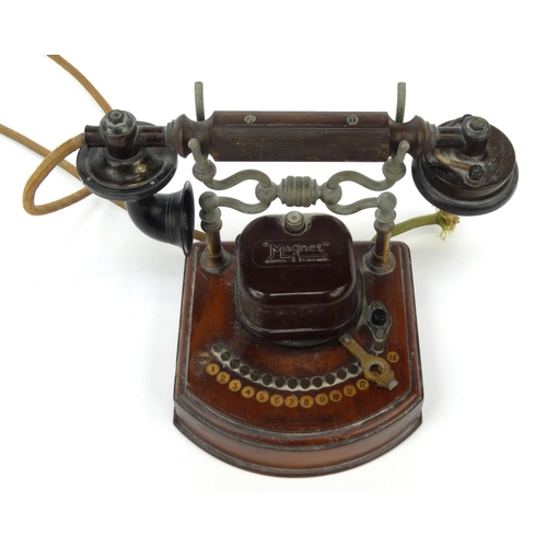 38 - Magnet wooden and Bakelite telephone, Registered Trade Mark, 26cm high