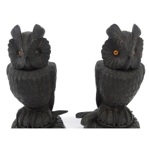 48 - Pair of Victorian bog oak owl pots and covers with beaded glass eyes, each 17cm high