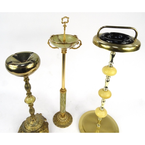 51A - Three brass and onyx effect smoker's stands