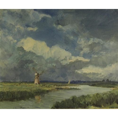 1345 - Oil onto board of a marsh-lined river before a windmill, bearing a signature Juhan Phipps 52, ornate... 