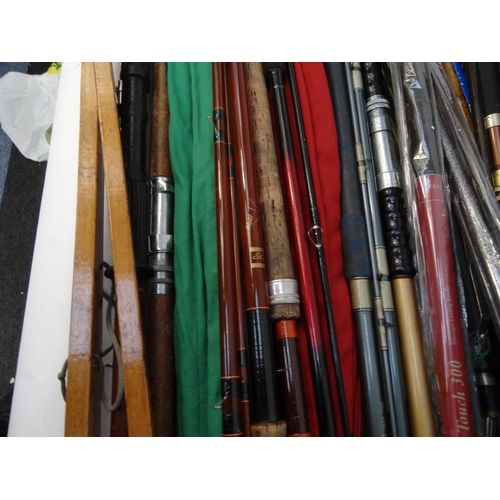 532 - Large selection of mostly sea-fishing rods, together with some landing nets