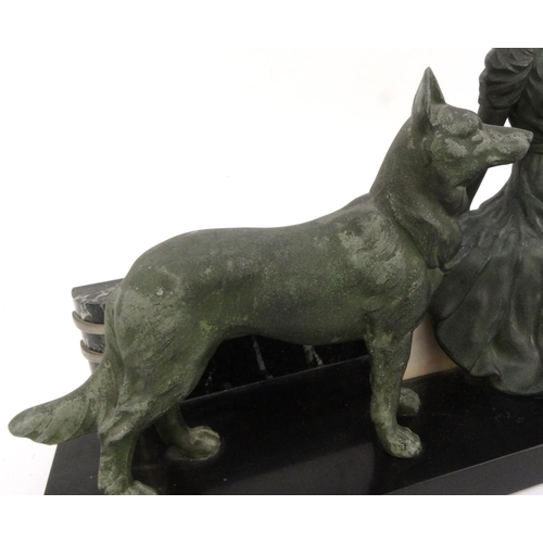 501 - Art Deco slate marble centrepiece mounted with a spelter lady in a flowing dress and dog, 67cm long