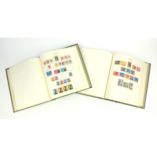 287 - Two New Age stamp albums with assorted British Commonwealth stamps